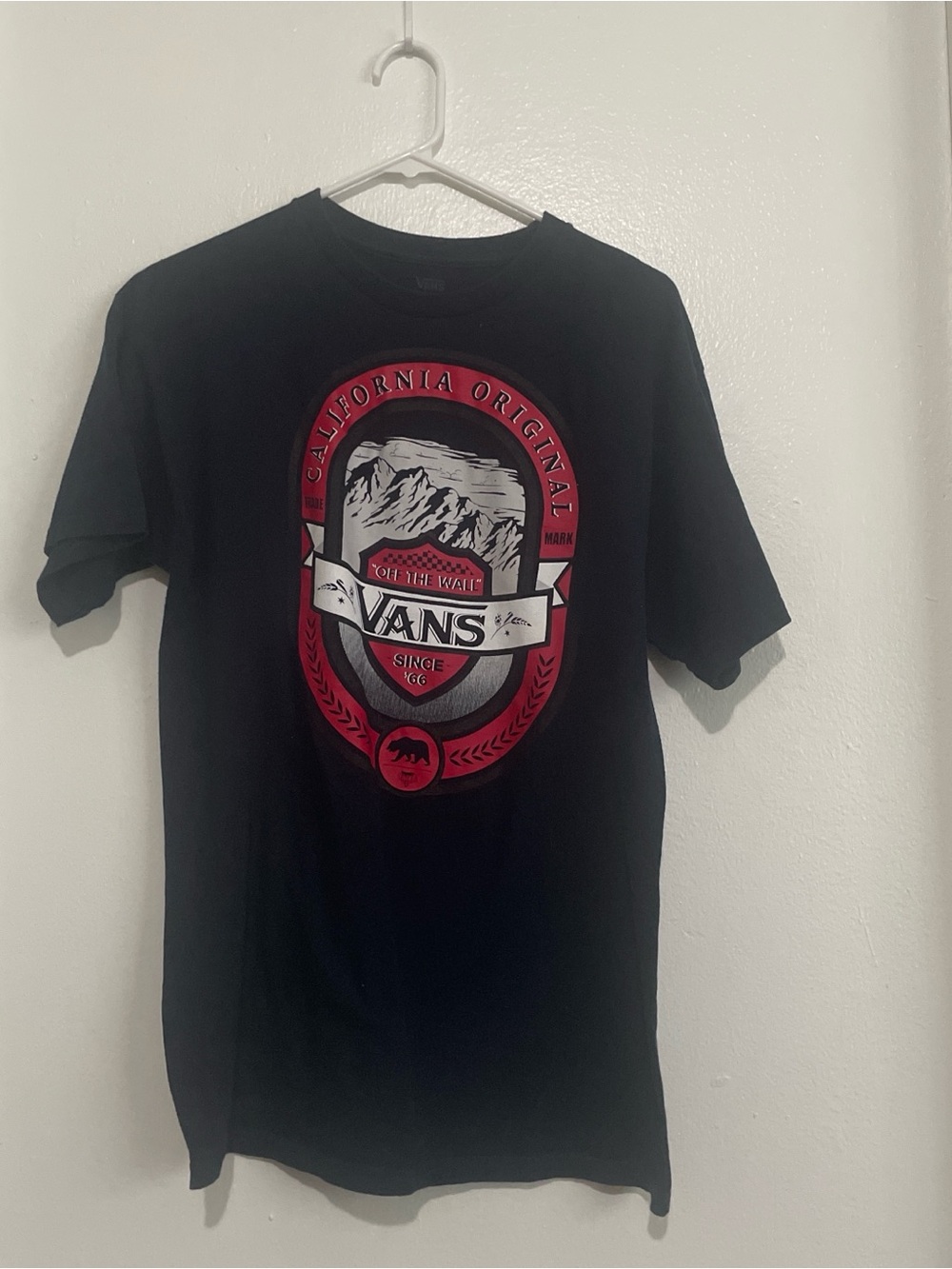 Vans Black Short Sleeve Tee with Red and White Crest Graphic